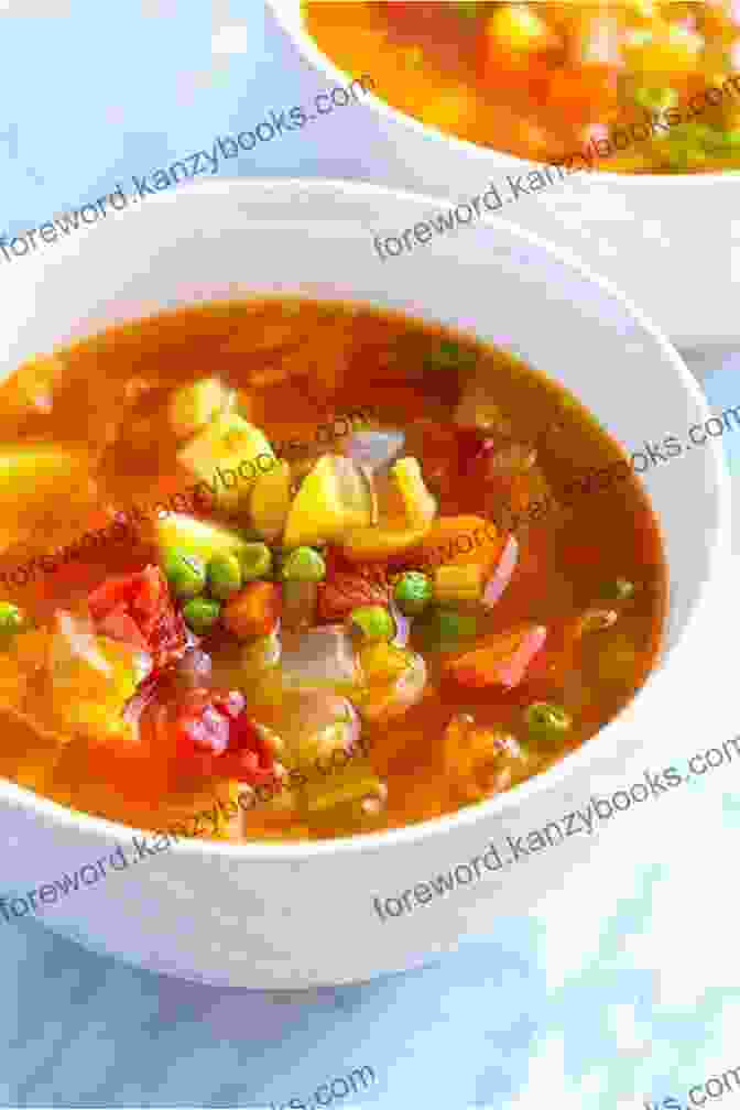 A Steaming Bowl Of Soup With Colorful Vegetables And Herbs Simply Soup Deborah Smith